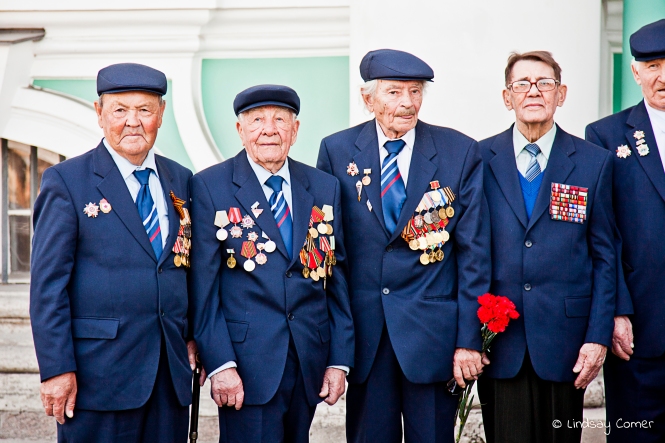A candid shot of veterans posing for the media on Victory Day; Saint Petersburg, Russia.