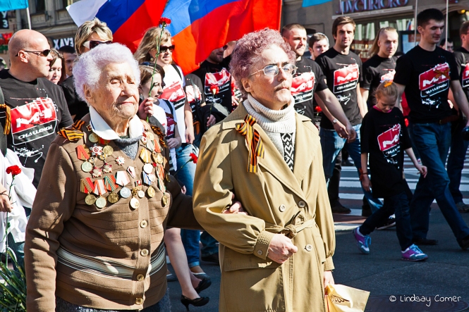 Two Russian woman marching in the Victory Day Parade; Saint Petersburg, Russia.