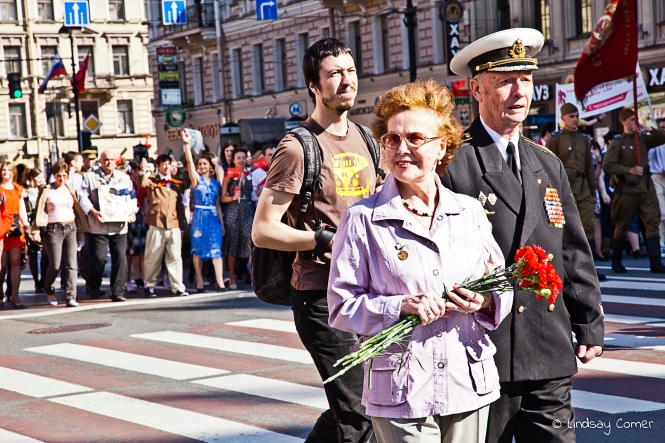 A Russian veteran and his "wife" marching in the Victory Day Parade, Saint Petersburg, Russia. 